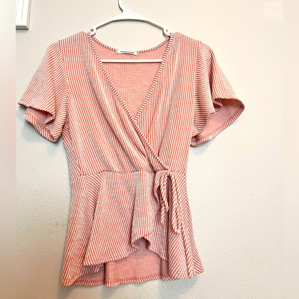 Pink and white striped shirt. Short sleeve. Brand: CAUTION TO THE WIND